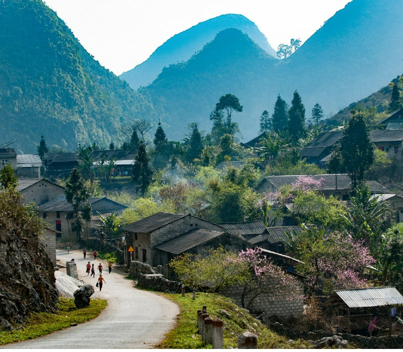 The space of Dong Van Ancient Town amidst the surrounding mountains and forests.