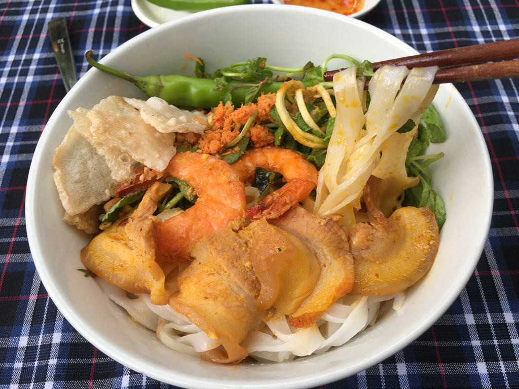 Quang noodles are long noodles, served with shrimp, meat, vegetables, and rich broth