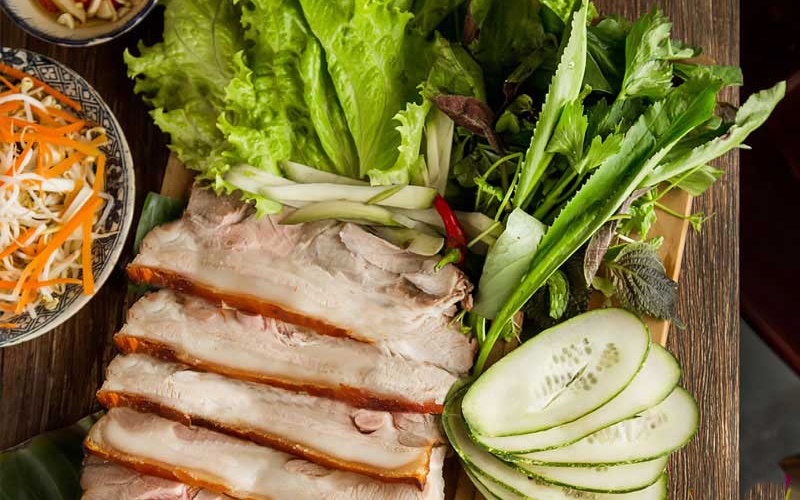 Boiled pork, thinly sliced, served with raw vegetables and rich fish sauce